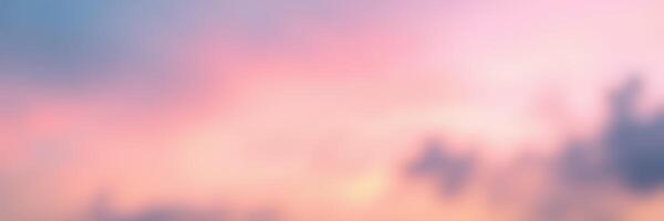 Colorful sunset sky transitioning from warm hues to cool tones over serene landscape photo