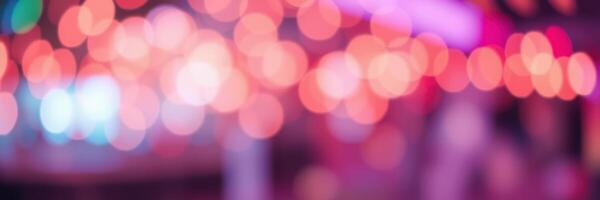 Colorful bokeh lights create an enchanting atmosphere at an outdoor event in the evening photo