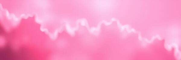 Vibrant pink abstract background with soft waves and blurred edges creating a dreamy atmosphere photo