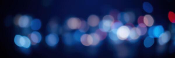 Vibrant city lights create a mesmerizing bokeh effect during nighttime urban exploration photo