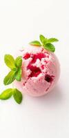 Refreshing raspberry sorbet garnished with mint leaves on a white background photo