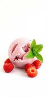 Sweet raspberry sorbet served with fresh raspberries and mint leaves on a clean white background photo