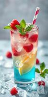 Refreshing layered beverage with ice and fruit in vibrant colors served in a tall glass photo
