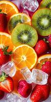 Fresh fruit display featuring strawberries, oranges, kiwis, and ice cubes in a vibrant arrangement photo