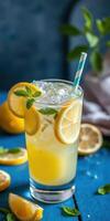Refreshing lemonade with fresh mint and lemon slices served in a tall glass photo