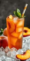 Refreshing peach iced tea served in a tall glass with mint garnish and ice photo