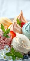 Delicious assortment of colorful ice cream scoops garnished with fresh mint and edible flowers photo