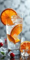 Refreshing beverage with orange slices and ice served in a tall glass photo