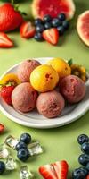 Colorful assortment of fruit-flavored sorbet served on a white plate with fresh berries and citrus slices photo