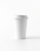 Plain white coffee cup standing alone on a clean surface with no distractions in the background photo