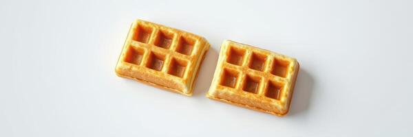 Deliciously golden waffles served on a clean white plate ready for breakfast or brunch enjoyment photo
