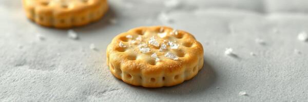 Delicious golden cookie topped with sparkling sugar displayed on a textured surface photo