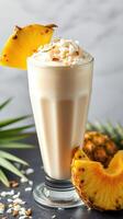 Refreshing tropical smoothie topped with coconut and pineapple garnished, perfect for summer enjoyment photo