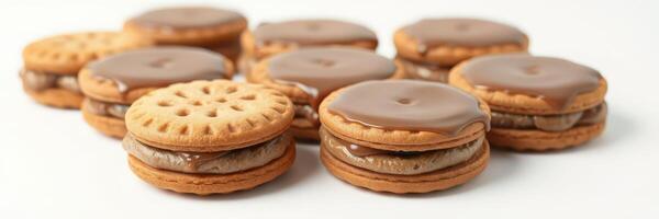Delicious chocolate and cream sandwich cookies arranged neatly on a white background for a tempting treat display photo