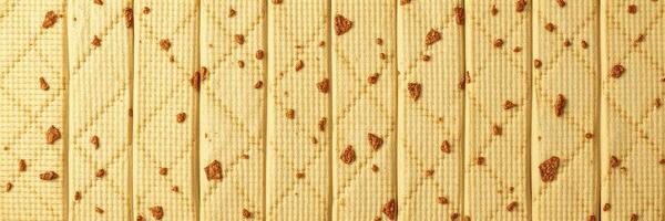 Textured surface with brown blemishes on a light golden background illustrating natural design detail photo