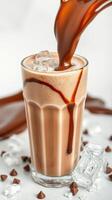 Creamy chocolate drink with ice cubes and chocolate drizzle for a refreshing treat photo
