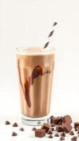 Delicious chocolate milkshake topped with a striped straw and drizzled chocolate photo