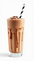 Creamy chocolate shake served in a tall glass with a striped straw and dripping chocolate syrup photo