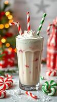 Festive milkshake with candy canes and whipped cream on a holiday table photo