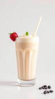 Refreshing strawberry smoothie with whipped cream and coffee beans on a light background photo
