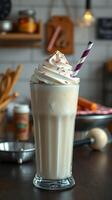 Delicious creamy milkshake topped with whipped cream and colorful sprinkles in a cozy cafe setting photo