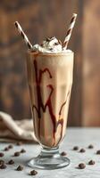 Delicious chocolate milkshake with whipped cream and chocolate drizzle served in a tall glass photo