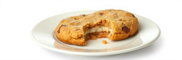 Freshly baked chocolate chip cookie on a plain plate with a bite taken out photo