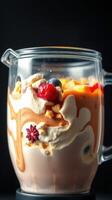 Delicious dessert with layers of cream, fruit, and sauces in a glass jug showcasing vibrant colors and textures photo