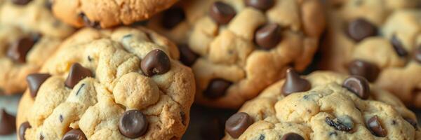 Freshly baked chocolate chip cookies stacked on a cooling rack in a cozy kitchen setting photo