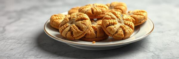 Freshly baked peanut butter cookies on a decorative plate ready to be enjoyed photo