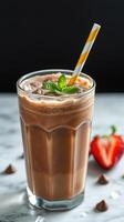 Chilled chocolate beverage with mint and a strawberry, ready to enjoy on a warm day photo
