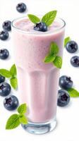 Refreshing blueberry smoothie with mint leaves garnishing and fresh blueberries on display photo