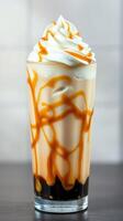 Delicious caramel iced coffee topped with whipped cream and caramel drizzle at a cafe photo