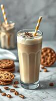 Iced coffee with whipped cream and cookies served in a stylish glass at a cafe during a sunny afternoon photo
