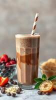 Smoothie with chocolate and fruit garnishes on a light background featuring a straw and healthy snacks photo