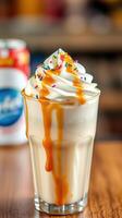 Creamy caramel sundae with whipped cream and colorful sprinkles served in a glass photo