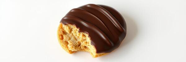Delicious chocolate-coated cookie with a bite taken from it on a plain background photo