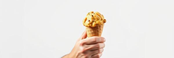 Enjoying a delicious ice cream cone filled with chocolate chip cookie dough on a warm afternoon photo