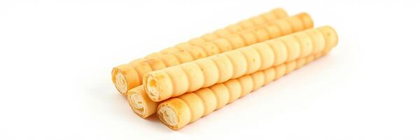 Delicious rolled wafer snacks stacked on a white background ready for enjoyment at any time photo