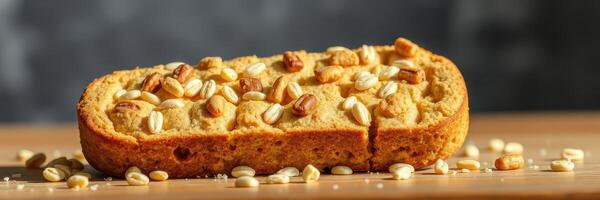 Delicious homemade oat bread garnished with nuts on a wooden table in a kitchen setting photo