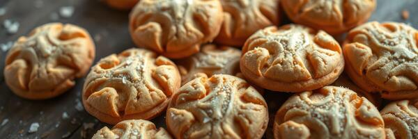 Delicious baked cookies arranged on a dark surface with a rustic appearance and intricate patterns photo
