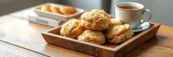 Freshly baked scones served with coffee on a wooden table in a cozy setting photo