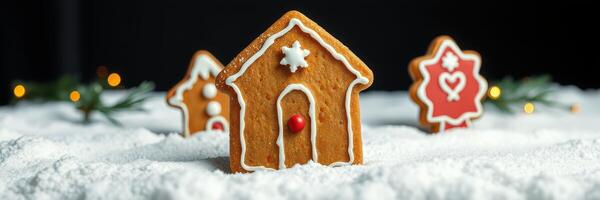 Gingerbread houses and decorations on snowy surface with festive lights photo