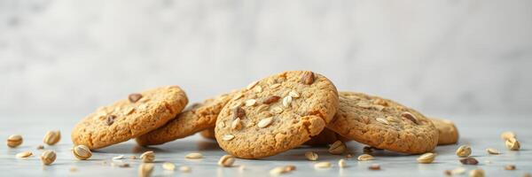 Enjoying fresh oatmeal cookies on a rustic table with scattered oats and a simple background photo