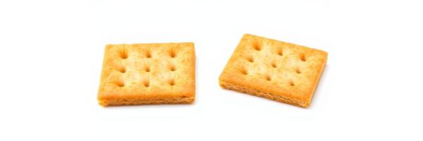 Savory crackers placed on a white surface highlighting their crispy texture and golden color photo