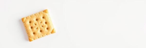 Unique cracker prominently displayed on a white background, highlighting texture and design at midday photo