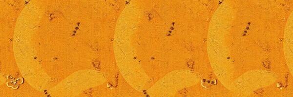 Abstract textured background in warm orange tones with circular patterns and subtle markings photo