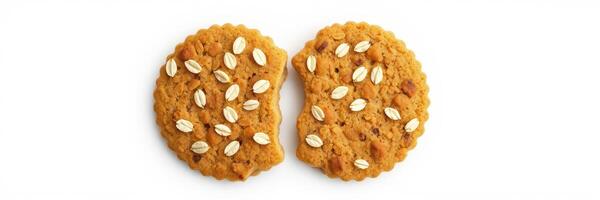 Delicious oatmeal cookie split in half revealing texture and ingredients on a white background photo