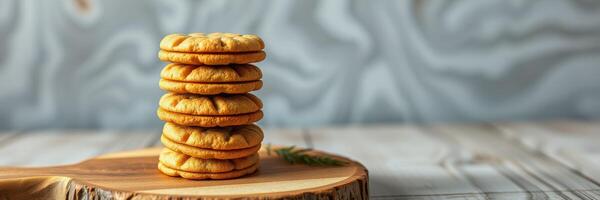 Delicious homemade cookies stacked on a wooden serving board in a cozy kitchen setting photo
