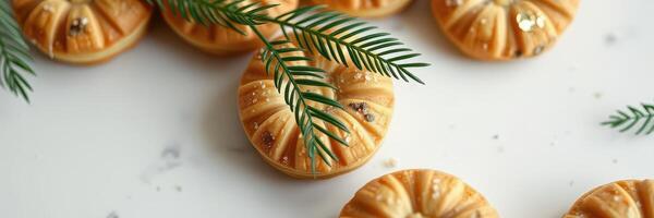 Deliciously crafted cookies arranged with greenery on a textured surface for a cozy autumn ambiance photo